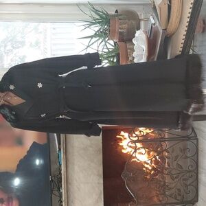 Elegant Black Coat with Goat Fur and Star Accents